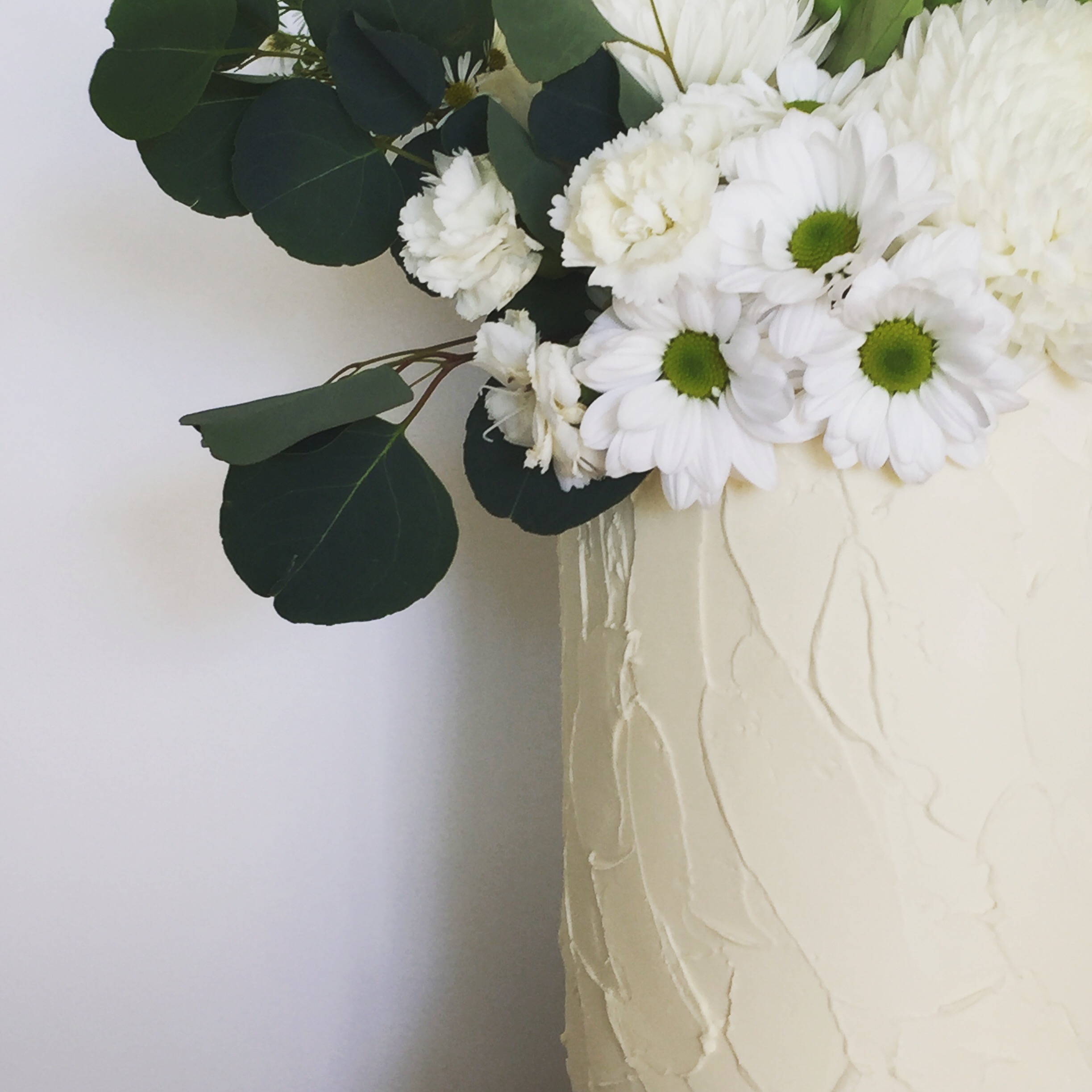 wedding cake with native blooms