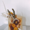Cake with dried oranges, gold lead and preserved flowers