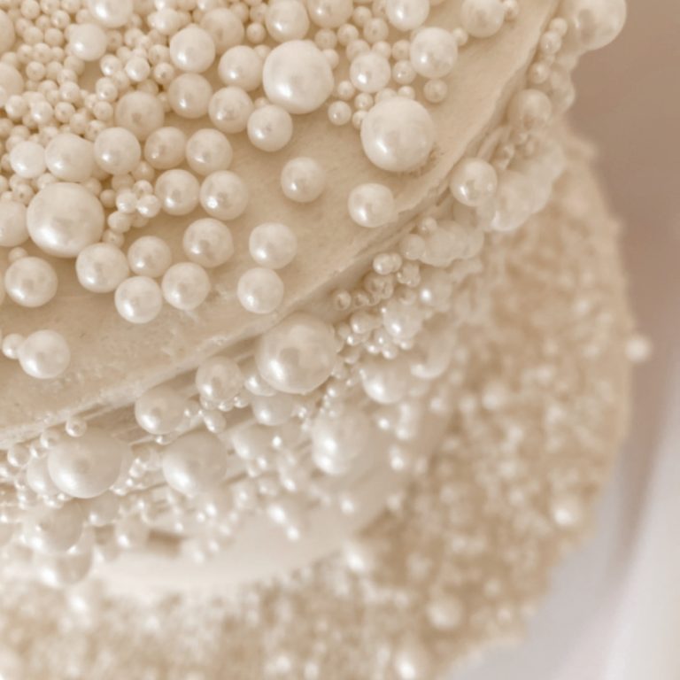 Two tiered luxury pearl adorned wedding cake by Original Cyn Cake Design for a beautiful Geelong Wedding.