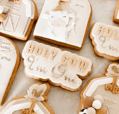 Hand-decorated Surf Coast cookies with edible art, custom colours and designs 1st birthday farm theme